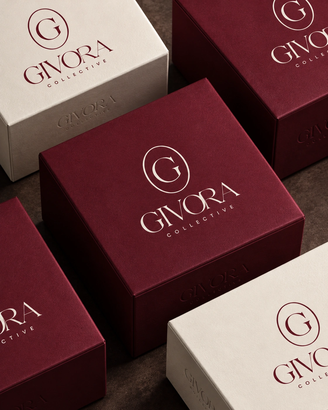 A collection of Burgundy and Ivory Givora gift boxes