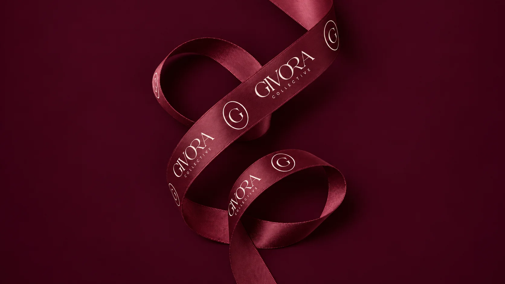 Burgundy Givora ribbon with Ivory wordmarks, arranged in soft folds